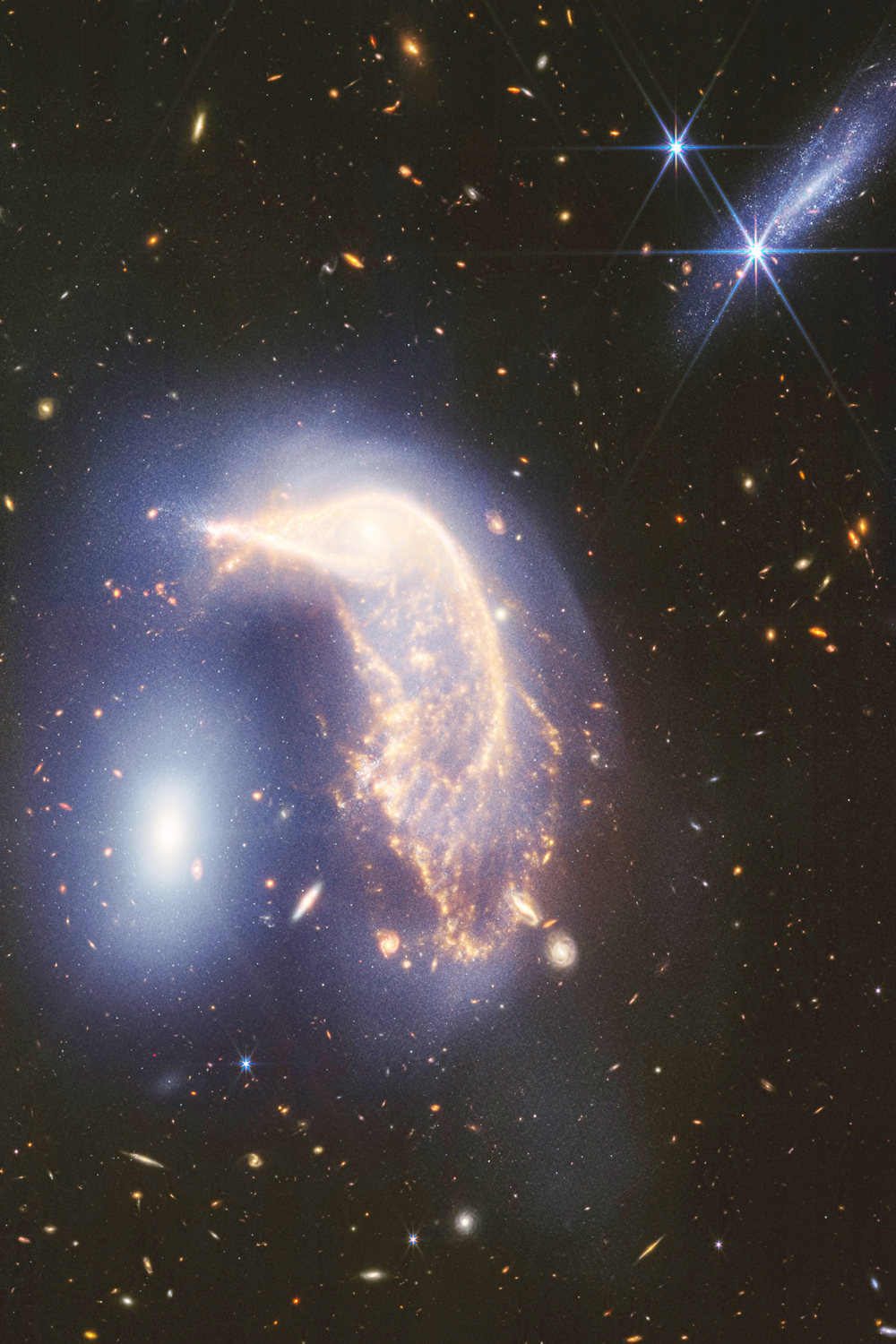 Nueva foto del telescopio Webb muestra dos galaxias “danzando”, en su segundo aniversario